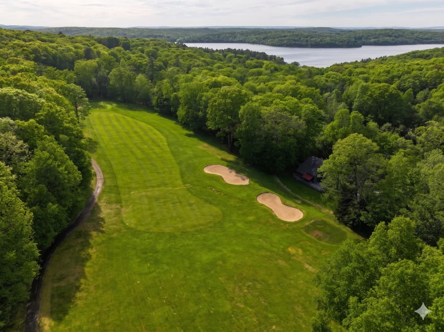 Hole 6 dogleg left at Paupack Hills with Lake Wallenpaupack in the distance